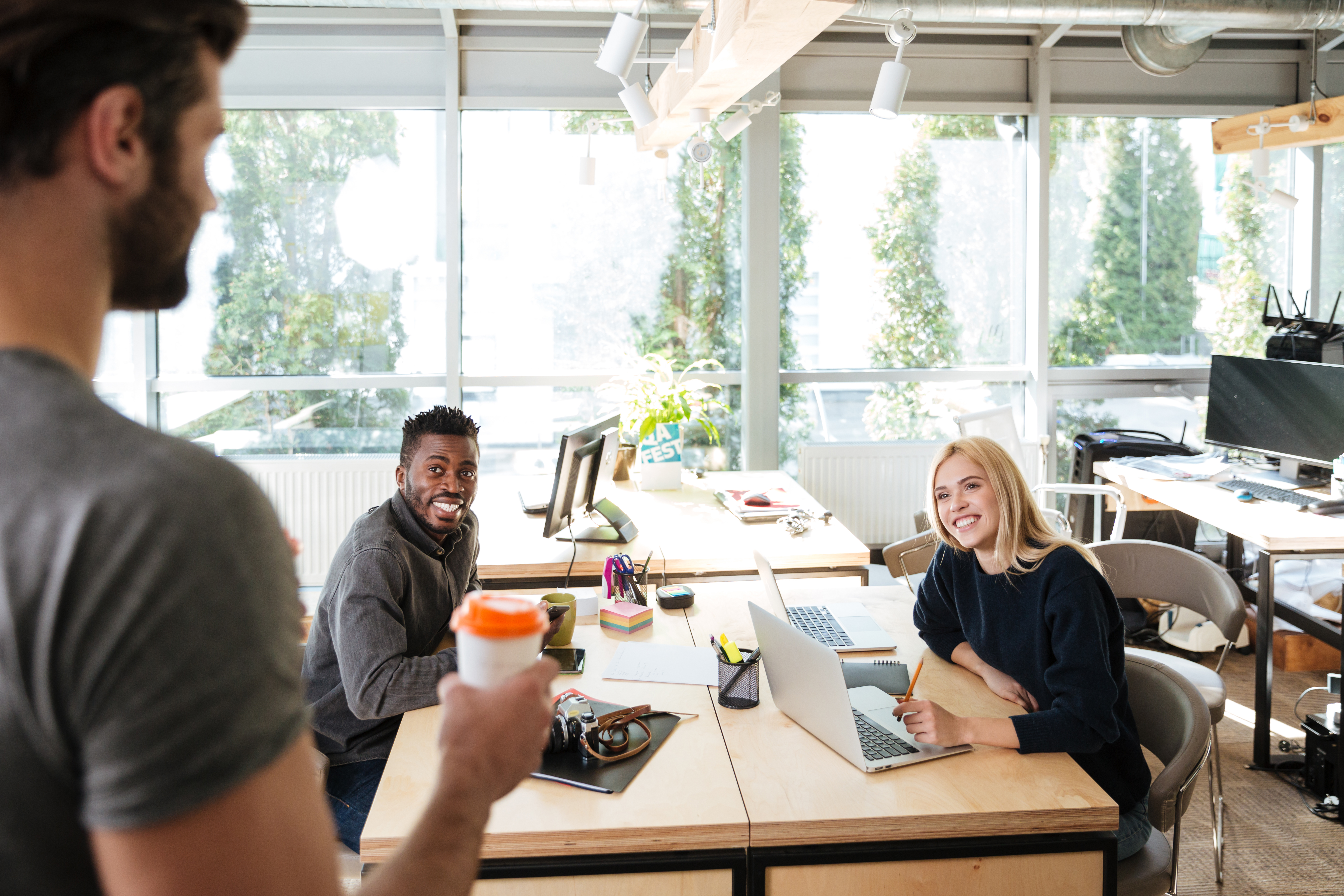 Colleagues reviewing information together in a coworking office