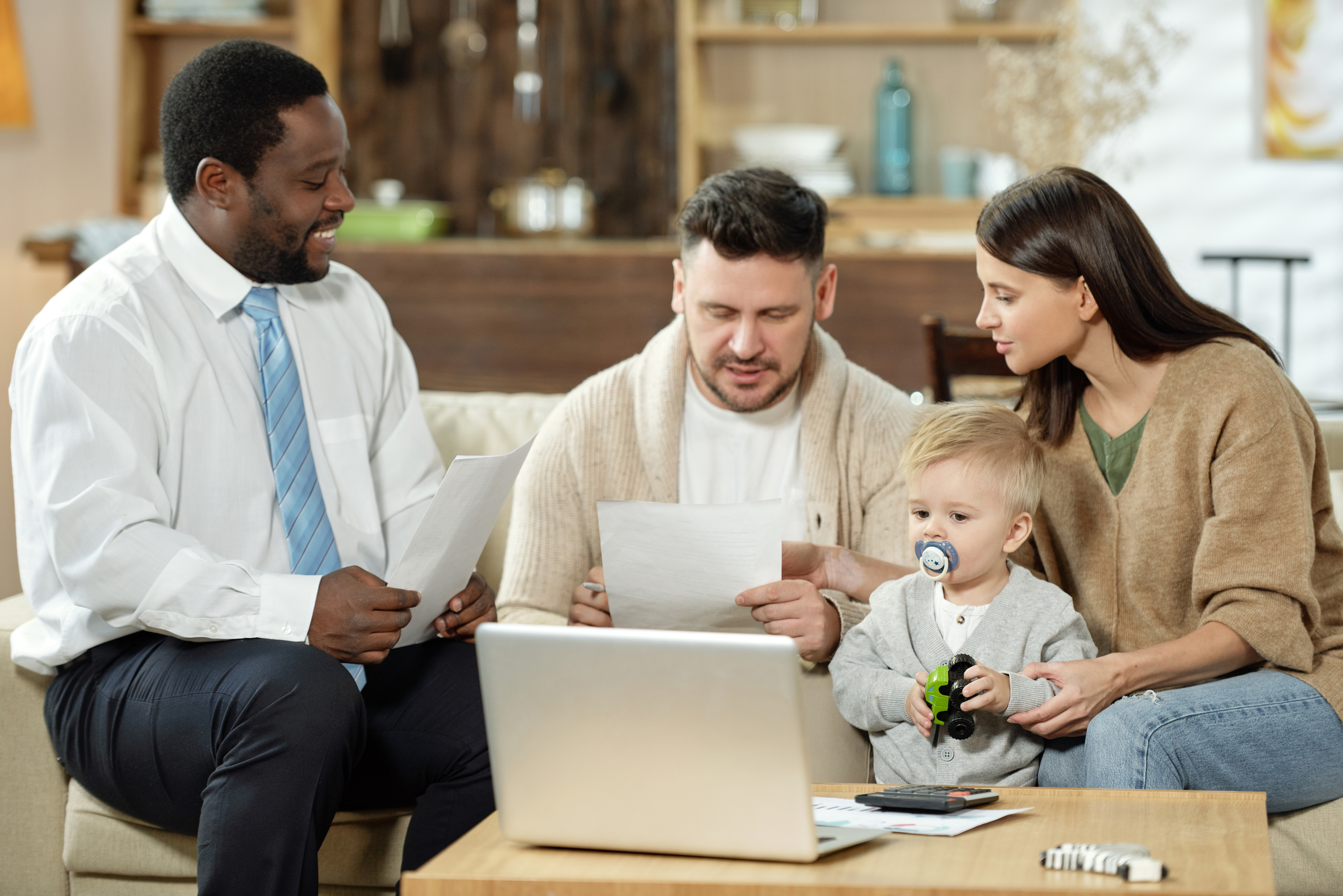 Florida family reviewing individual and family health coverage paperwork with a licensed agent at home